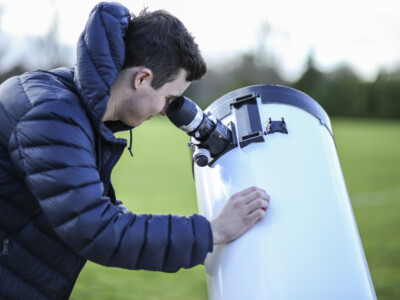 Boy using observatory cameras