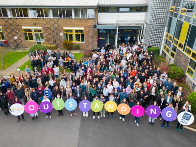 Students holding Ofsted boards up