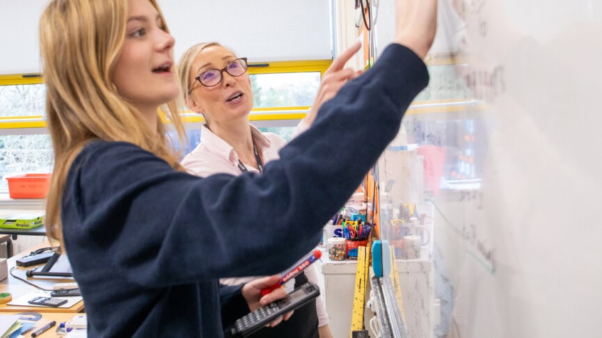 female maths students at the whiteboard