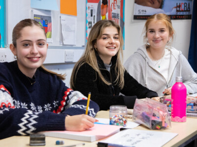 Three female students in French class