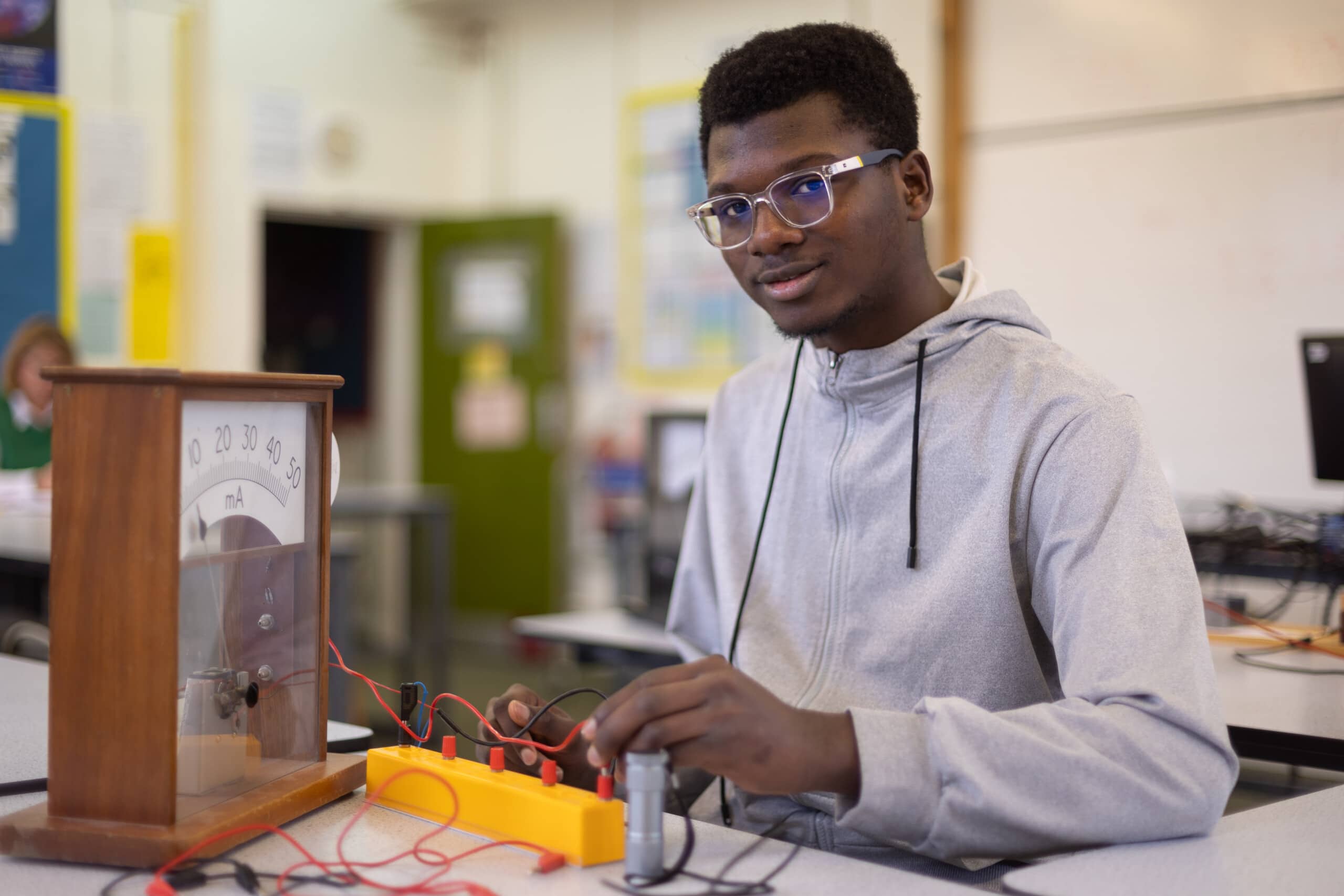 Physics student working with some wires