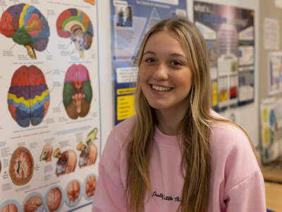 Connie with poster of brain