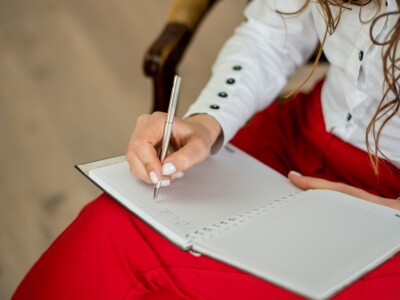 Lady writing in a book