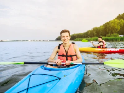 Young man on kayaking on a lake