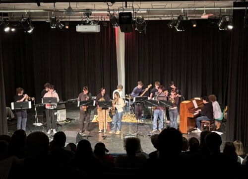 Large Jazz band on stage performing to a crowd