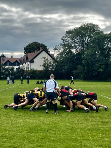 men's rugby team in a scrummage