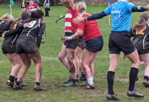 Women's rugby team in a scrum