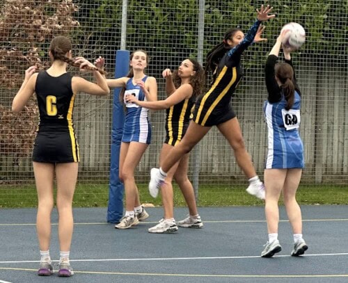 Netballer leaping in the air to get the ball